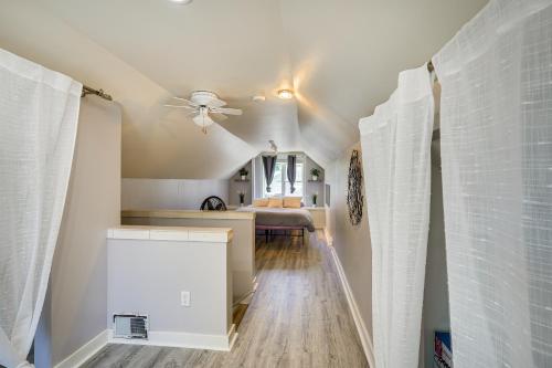 a hallway with a ceiling fan and a bedroom at Minneapolis Home Mins From US Bank Stadium and More in Golden Valley
