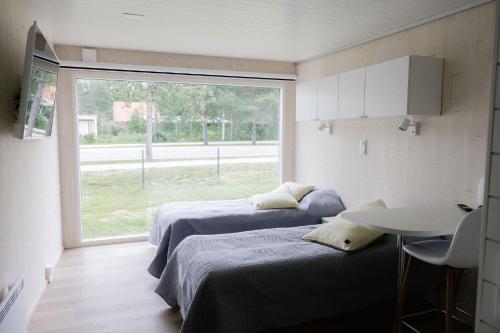Postel nebo postele na pokoji v ubytování Hotel OmaBox - Nivala - Oma huoneisto saunalla