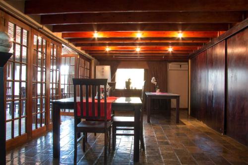 a dining room with a table and two chairs at Zoete Rust Boutique Hotel in Lephalale