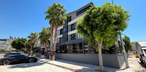 a black car parked in front of a building at Hayal Fener in Antalya
