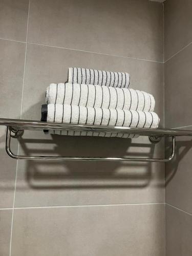 a towel rack with towels on it in a bathroom at Vista Studio in Bakuriani