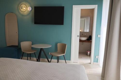Katil atau katil-katil dalam bilik di Suites Dimora Garibaldi