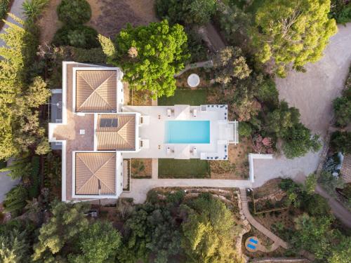 an aerial view of a white house with a pool at Octant Vila Monte in Moncarapacho