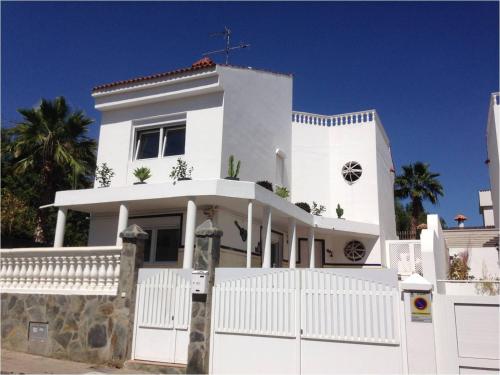 a white house with a white fence in front of it at Casa Panorámica in Maspalomas