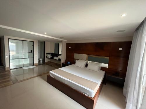 En eller flere senge i et værelse på HOTEL PORTELÃO