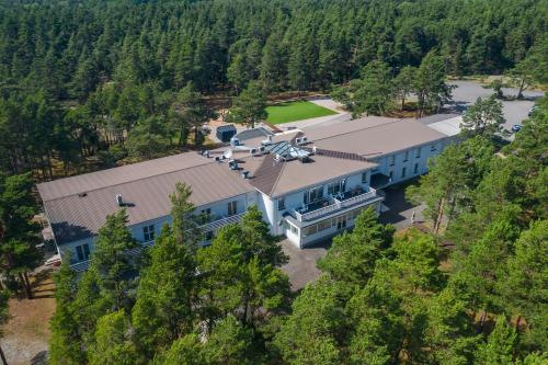 an aerial view of a building with a plane on the roof at Saaremaa Rannahotell ' Beach Hotel in Mändjala