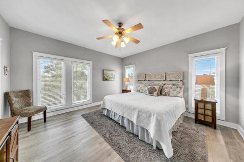 a bedroom with a bed and a ceiling fan at Seashine and Sunkises - Great pricing near Seaside in Santa Rosa Beach