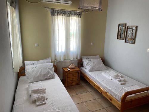Voodi või voodid majutusasutuse Sea Urchin Apartment Neos Kosmos toas
