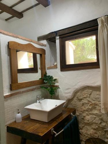 a bathroom with a sink and a mirror at Casas de Almajar in Prado del Rey