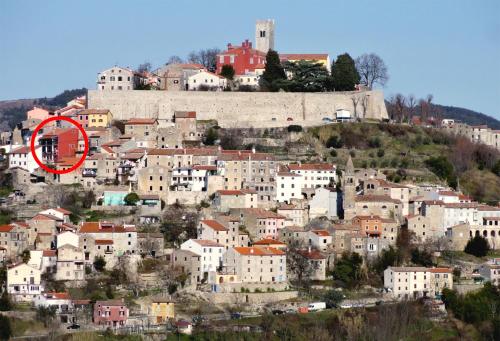 a town on a hill with a red circle on it at Guesthouse Villa Marija in Motovun