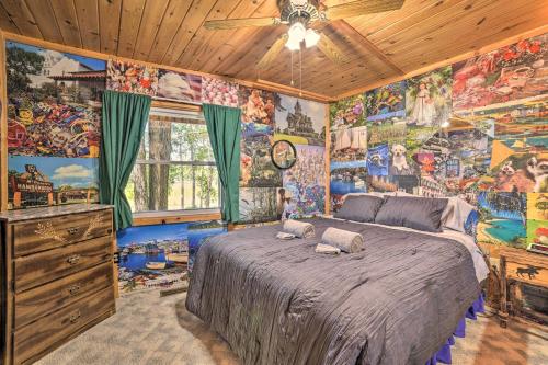 a bedroom with a bed in a room with colorful walls at Atlanta Waterfront Cabin with Dock and Kayaks! 