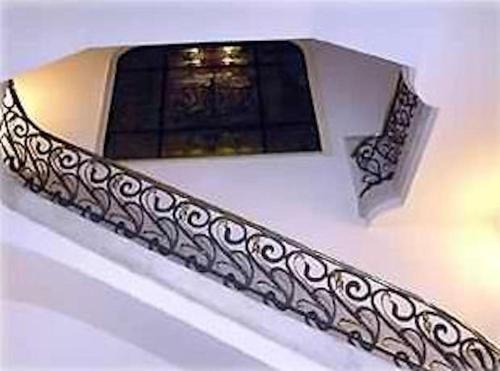 a stair railing in front of a window at Passeig de Gracia Studio Loft in Barcelona