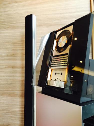 a laptop sitting on top of a glass case at Tabist Hotel Smart Sleeps Oita Station in Oita