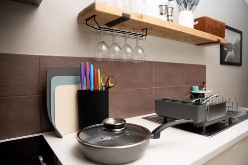 a kitchen counter with a pot on a stove at High Street Town House in Manchester