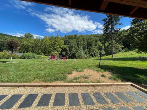 a view of a field of grass with trees in the background at Sonsak - Unit 1 in Charlottesville