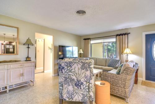 a living room with a couch and a chair at 4 Mi to Dog Beach Largo Home with Pool and Hot Tub! in Largo