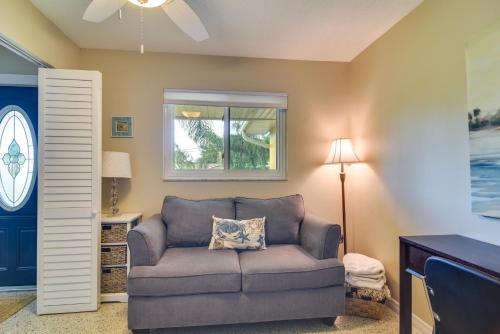 a living room with a couch and a window at 4 Mi to Dog Beach Largo Home with Pool and Hot Tub! in Largo