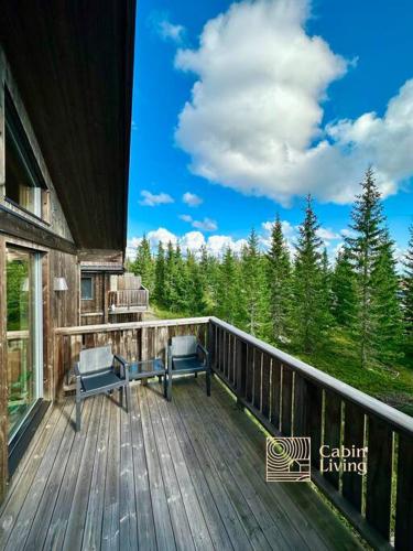 Ban công/sân hiên tại Sjusjøen ski in out, ski storage, Wifi, grill & fireplace, modern apartment!
