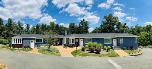 a blue house with a driveway at Sonsak - Unit 1 in Charlottesville