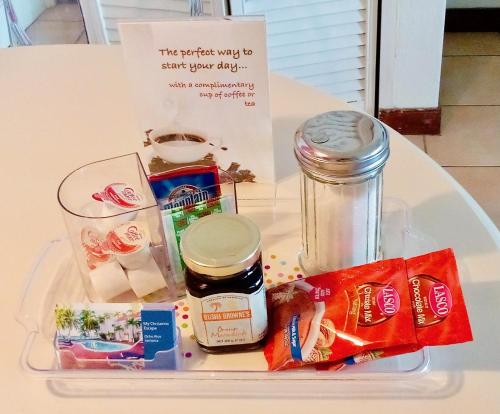 a plastic tray with food items on a table at Idyllic Beachfront Condo in Ocho Rios