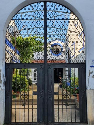 an entrance to a building with a glass door at Albariza Hotel Boutique in Sanlúcar de Barrameda