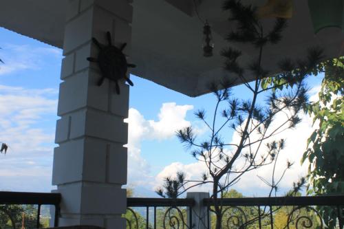 a view of the sky from under a porch at Mansarover Home Stay in Kalimpong