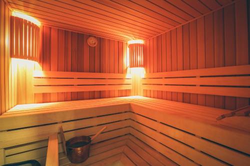 a sauna with a light on the inside of it at Best Western Premier Tuushin Hotel in Ulaanbaatar
