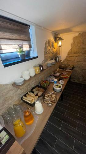 a long table with many different types of food on it at Penzion Loket in Loket