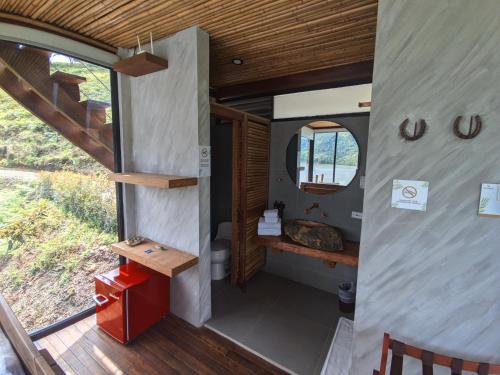 a view of the inside of a tiny house at Summer C in Macanal