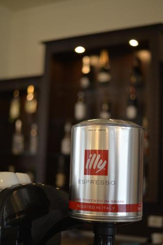 a metal can sitting on top of a table at Hotel Miky in Arad