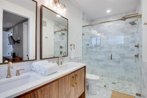 a bathroom with a sink and a shower at Modern Lawrence Home with Patio Less Than Half-Mi to U of K! in Lawrence