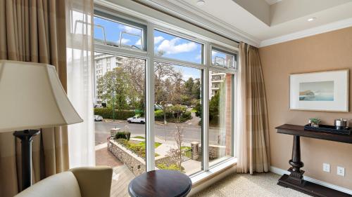 a room with a large window with a view of a street at Oak Bay Beach Hotel in Victoria
