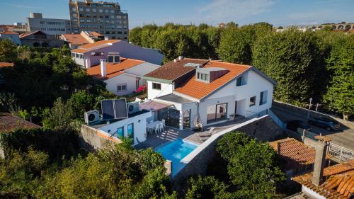 an aerial view of a house with a swimming pool at Romantic Pool House in Vila do Conde