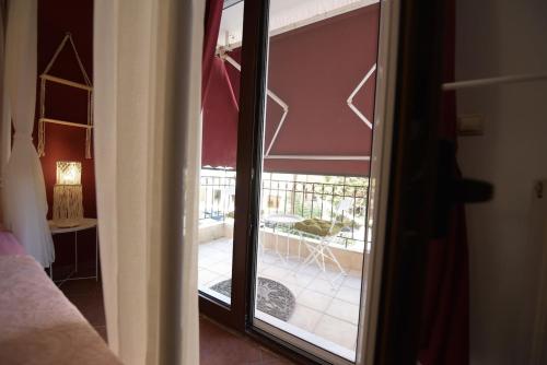 a view of a patio through a sliding glass door at AMALFI luxury APARTMENT in Komotini