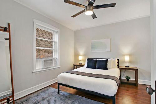 a bedroom with a bed and a ceiling fan at 1BR Serene and Cozy Chicago Apartment - Manor 2 in Chicago