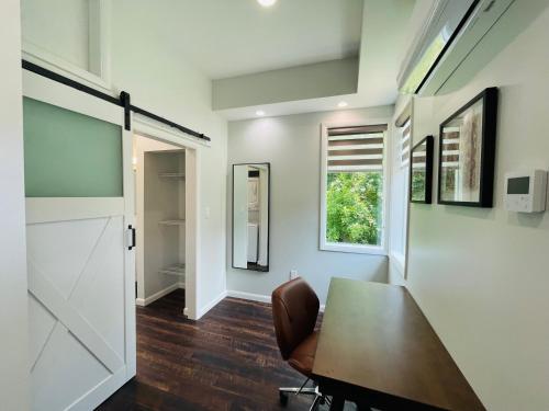 a dining room with a table and a window at Sonsak - Unit 4 in Charlottesville
