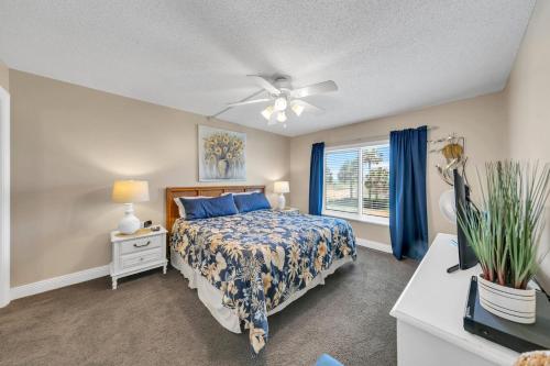 a bedroom with a bed and a window at Destin on the Gulf 205 - Updated Gulf Front Property with Free Beach Service in Destin