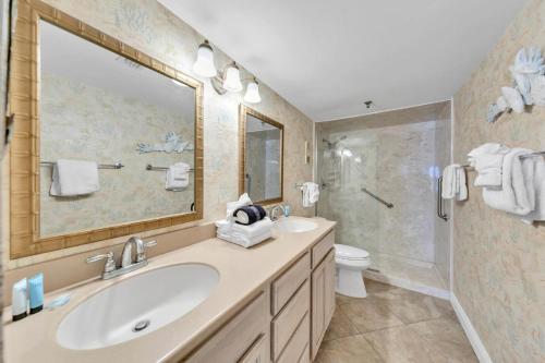a bathroom with a sink and a shower at Destin on the Gulf 205 - Updated Gulf Front Property with Free Beach Service in Destin