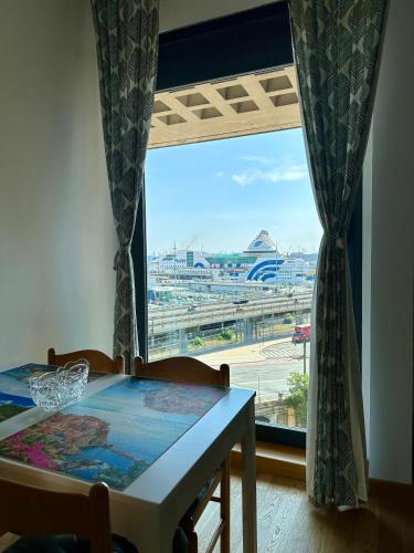 a dining room table with a view of an airport at Due Passi dal Porto in Genova