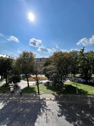 an overhead view of a street with trees and a building at Avenue Apart in Lviv