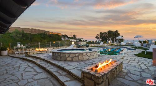 a patio with a pool and a fire pit at Beverly Estates in Los Angeles