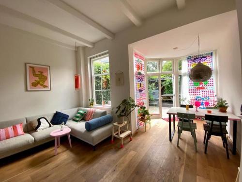 a living room with a couch and a table at The Great Hideaway in Vreeland