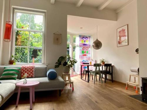a living room with a couch and a table at The Great Hideaway in Vreeland