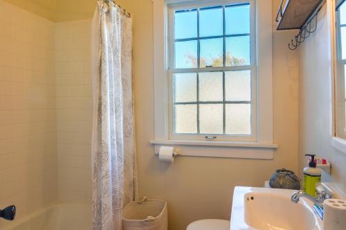 a bathroom with a sink and a toilet and a window at Cozy Adobe Casita 1 Mile to Santa Fe Plaza! in Santa Fe