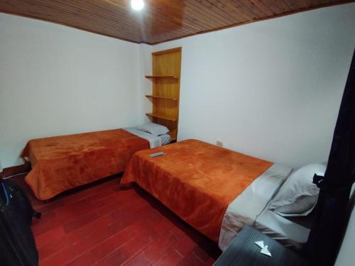 Postel nebo postele na pokoji v ubytování Casa Esther