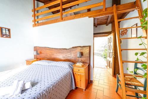 Ένα ή περισσότερα κρεβάτια σε δωμάτιο στο Agriturismo Pian di Fiume