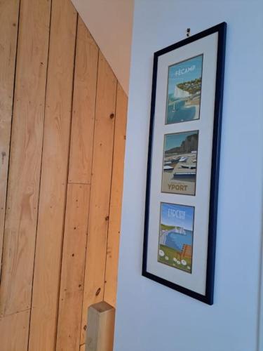 a picture hanging on a wall in a room at Le Gîte Du Jardin in Colleville