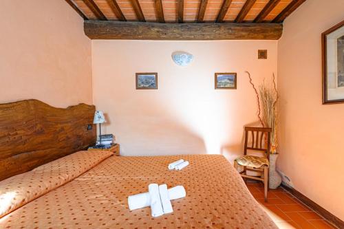 Ένα ή περισσότερα κρεβάτια σε δωμάτιο στο Agriturismo Pian di Fiume