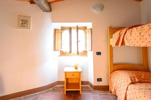 Ένα ή περισσότερα κρεβάτια σε δωμάτιο στο Agriturismo Pian di Fiume