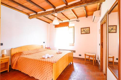 Ένα ή περισσότερα κρεβάτια σε δωμάτιο στο Agriturismo Pian di Fiume